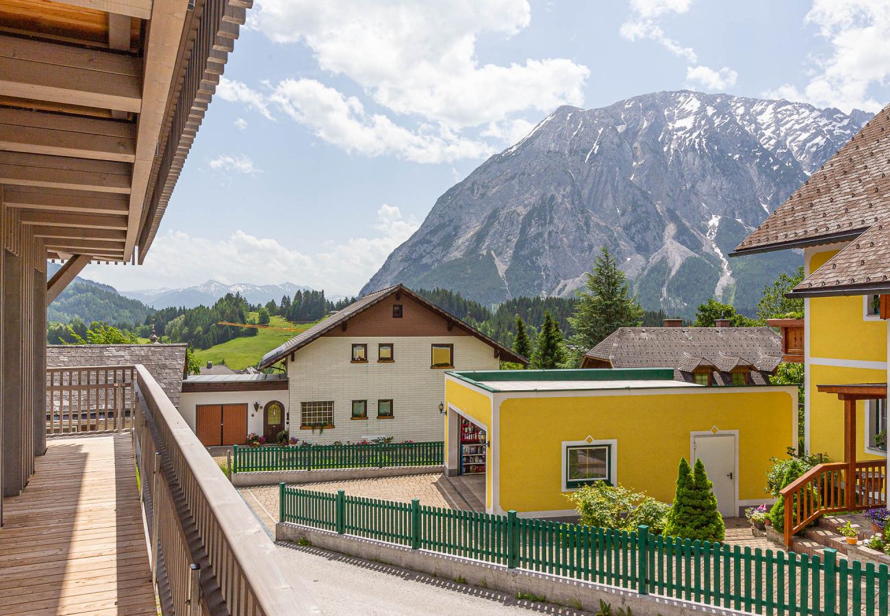 balcony with view to the mountain Grimming in the holiday home Grimming Lodge Distel in Tauplitz