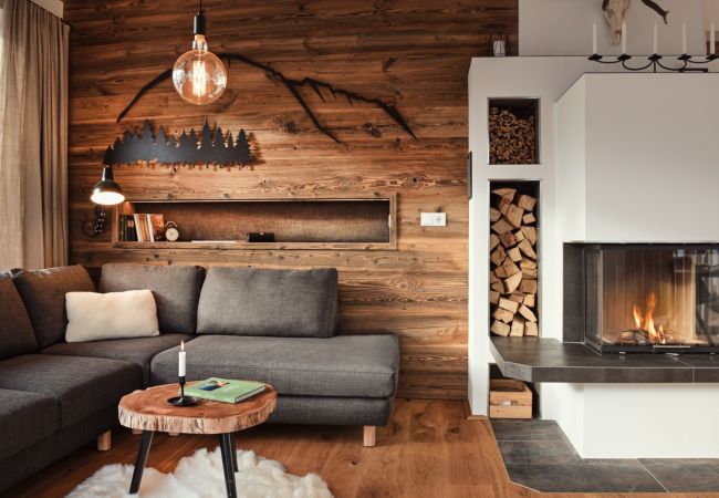 Living room with an alpine style in the Holiday Home Penthouse Grimming Adler Lodge D7.1 in Tauplitz