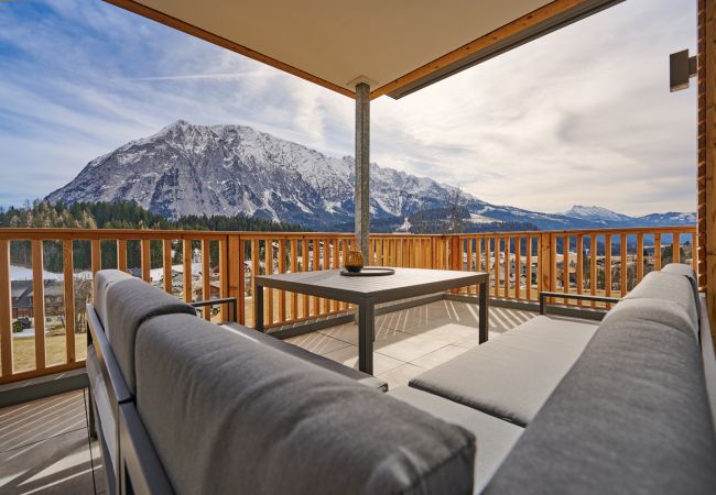 Terrace with a seating area in the holiday home flat Adler Auszeit Lodge D6 in Tauplitz