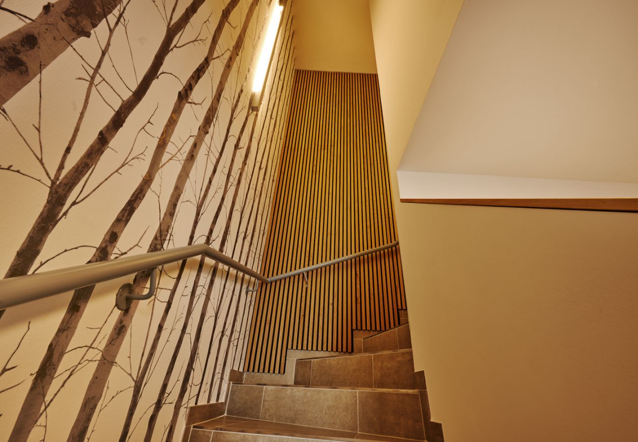 stairs leading up to the holiday flat Adler Auszeit Lodge D6 in Tauplitz