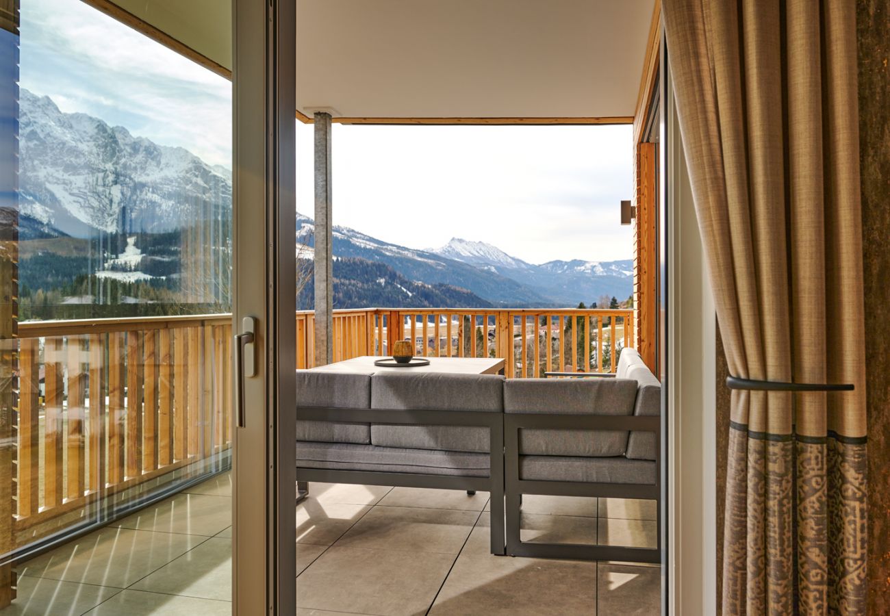 Terrace with an seating area in the holiday home flat Adler Auszeit Lodge D6 in Tauplitz