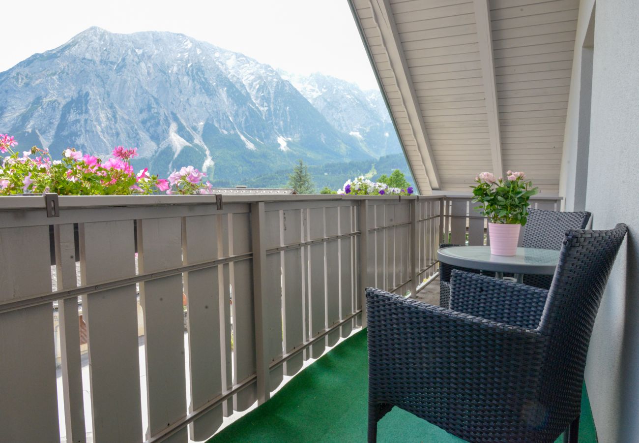 balcony with view in the holiday home Grimming Lodge Goldrute in Tauplitz