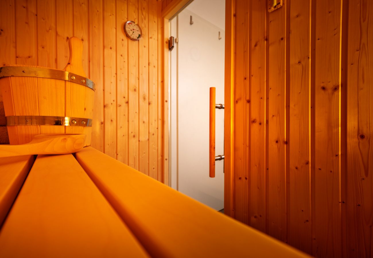 Bathroom with Sauna in the holiday home flat Adler Lodge D5 in Tauplitz