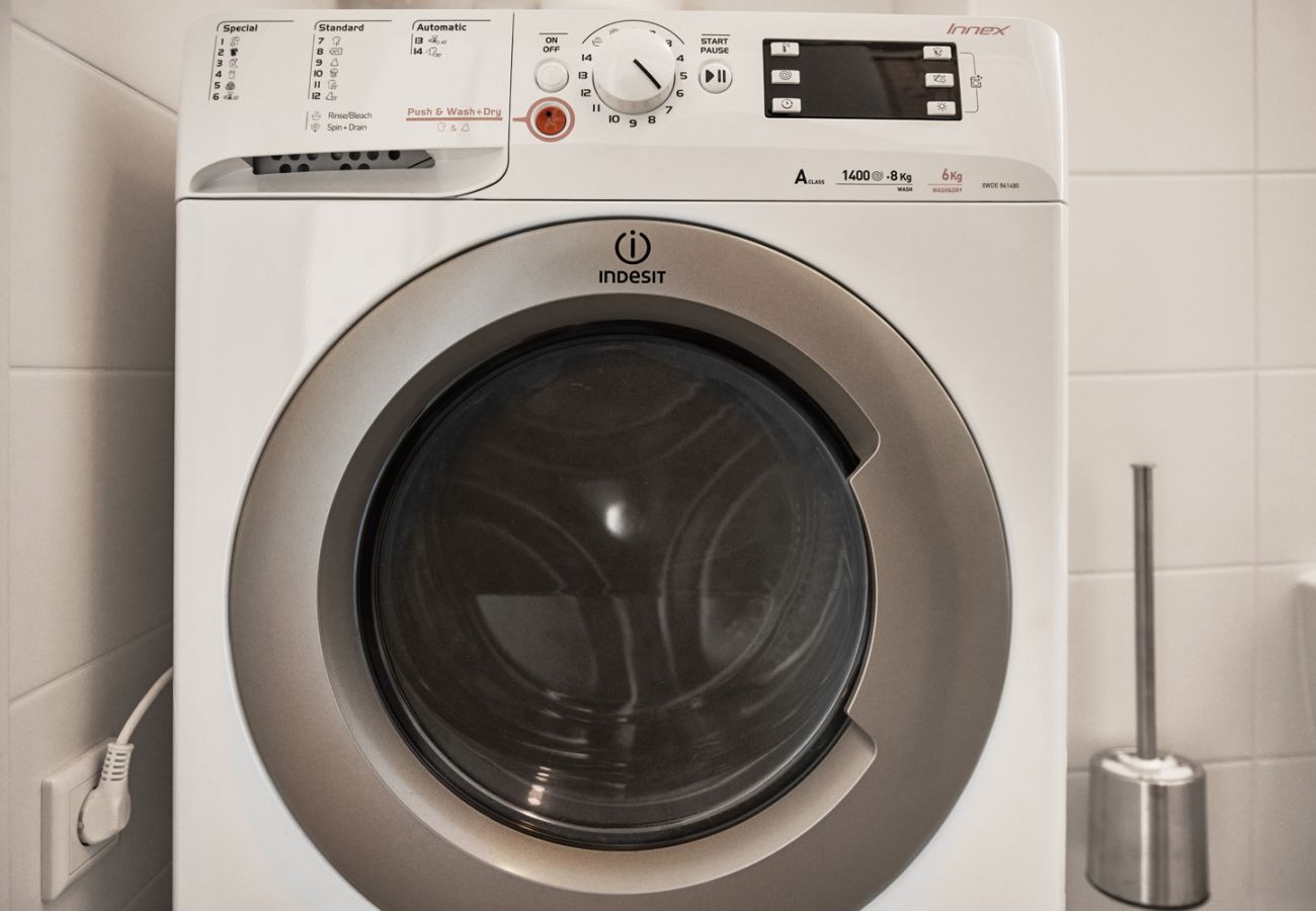 Bathroom with Washing machine in the Holiday home flat Adler Lodge D5 in Tauplitz, Details