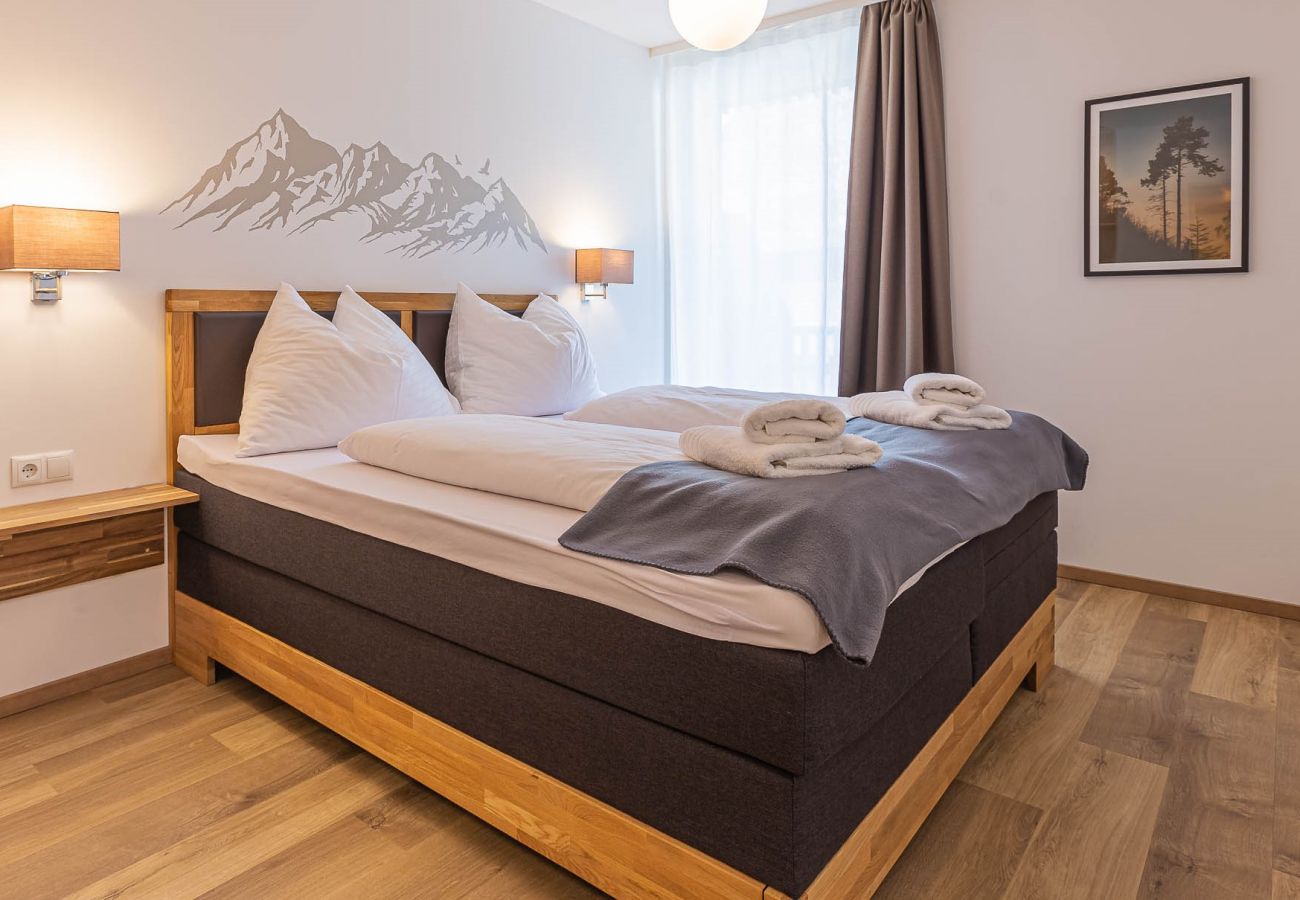 Schlafzimmer in der Ferienwohnung Grimming Lodge Distel in Tauplitz
